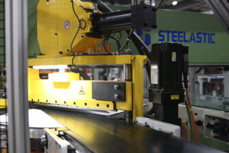 Steelastic Next Gen Belt tooling making pick and place of extruded steel belt material 
