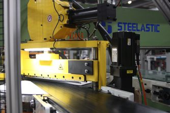 Closeup Photo of Yellow Steelastic Extruded Steel Belt Systems