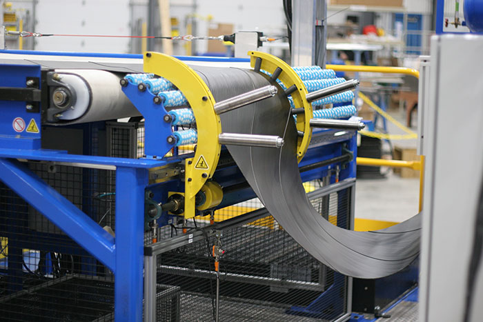 Image shows an extruded radial steel belt system that can be used for truck / bus radial (TBR) tire manufacturing.
